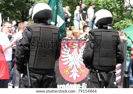 WARSAW, POLAND - JUNE 11: Police protect people taking part in Pride Parade 2011 to support gay rights, on June 11, 2011 in Warsaw, Poland.