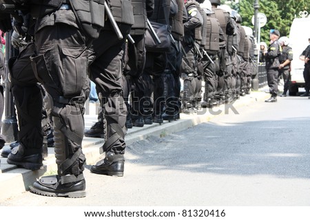 WARSAW, POLAND - JUNE 30:  Closeup of a police cordon protecting government buildings during anti government Solidarity demonstration on June 30, 2011 in Warsaw, Poland.