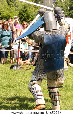 WARSAW, POLAND - JUNE 6: Two medieval knights fighting in a duel during XV Knight Tournament on June 6, 2010 in Warsaw, Poland.