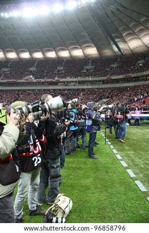 WARSAW, POLAND - FEBRUARY 29: Professional sports photographers during the friendly football match between Poland vs Portugal on February 29, 2012 in Warsaw, Poland. Final results: 0:0