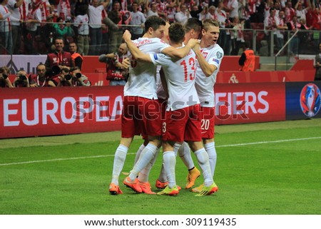WARSAW, POLAND - OCTOBER 11, 2014: Polish players enjoy after scoring a goal during the UEFA EURO 2016 qualifying match of Poland vs. Germany. Final result: 2:0 for Poland