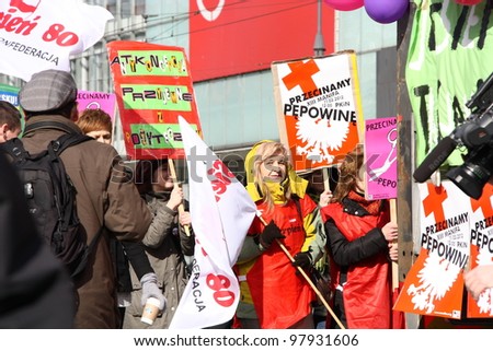WARSAW, POLAND - MARCH 11: People take part in Feminist demonstration to support women rights, on March 11, 2012 in Warsaw, Poland.