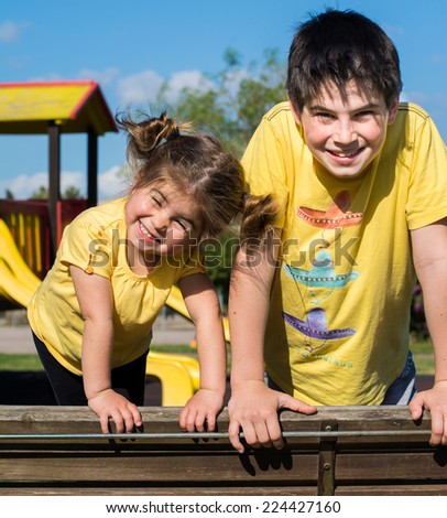 Brother and sister have a nice day at the park