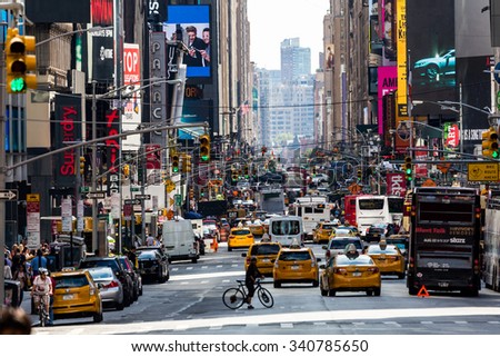 NEW YORK - AUGUST 22: Views of the rush streets of Manhattan at 7th Avenue on August 22, 2015. Its on the intersection of W53 Street near the Times Square.