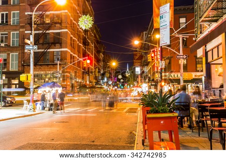 NEW YORK - AUGUST 22: View to the Mulberry Street at night in New York on August 22, 2015. The Mulberry Street is in the district called Little Italy, Manhattan.