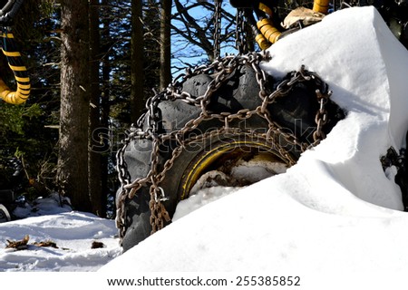 Monster Tire with Tire Chains in Winter