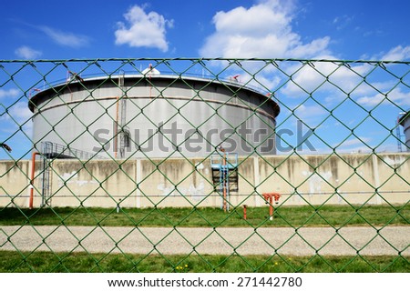 Mineral Oil Tank with Chain-Link Fence