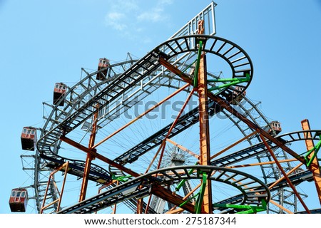 Roller Coaster in Front of the Vienna Ferris Wheel