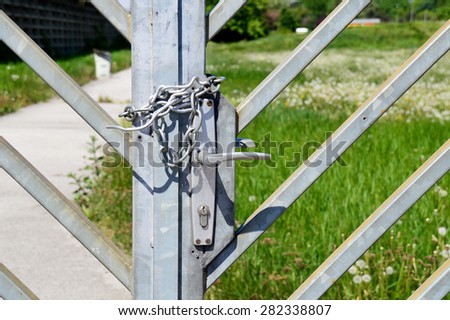 Iron Chain on a barred Double Gate