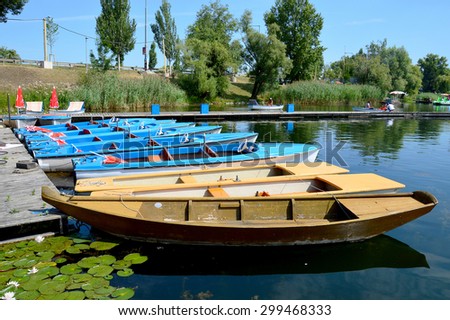 Rowing Boats and Electric Boats on a Pier