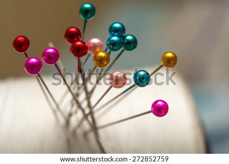 Many sewing push pins on paper drop ,focus on pin ball center , vintage style,Blur picture style