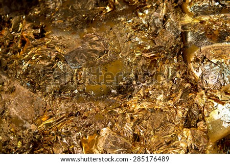 abstract Gold leaf on Buddha statue Body , in the Dark tone, Religion concept