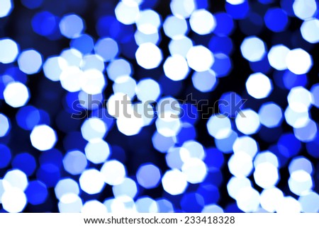 bright blue and white background of Christmas lights shining like fireworks