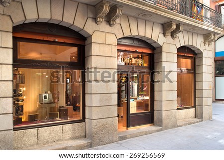 BARCELONA, SPAIN - 21 JUNE 2013: storefront of Limited Edition sneakers shop in vintage style 70 ies