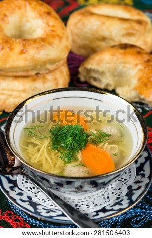 Chicken soup ugra osh with homemade noodles and chicken meatballs