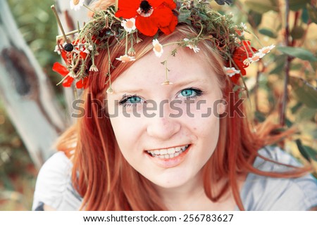 Spring. March 8 - International Women\'s Day. Girl with a wreath of spring flowers on her head