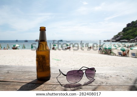 cold beer , vacation on the sea, sea beach,sun glasses on a tropical beach