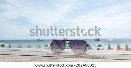 vacation on the sea, sea beach, sun glasses on a tropical beach