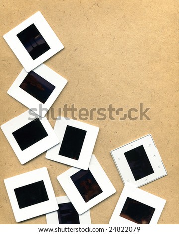 Scattered photographic slides on neutral background