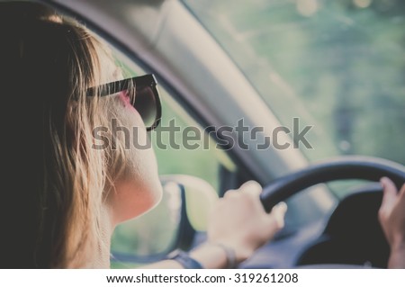 Girl in a car driving