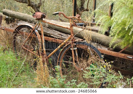 Old rusty bicycle, forgotten near the house in the Italian mountains