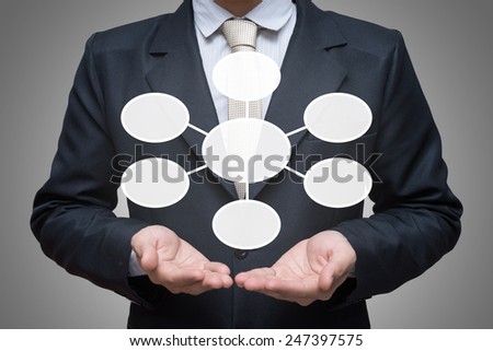Businessman standing posture hand holding strategy flowchart isolated on gray background