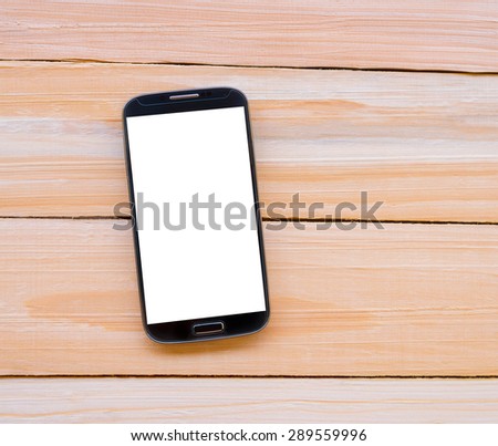 Smart phone on wooden desk