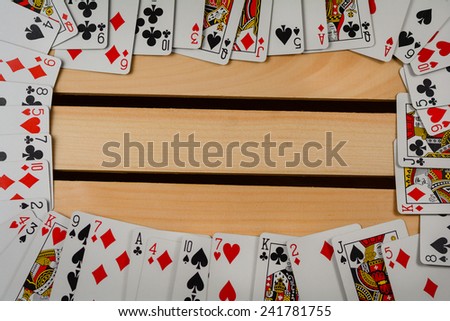 Playing cards arranged in a frame for background