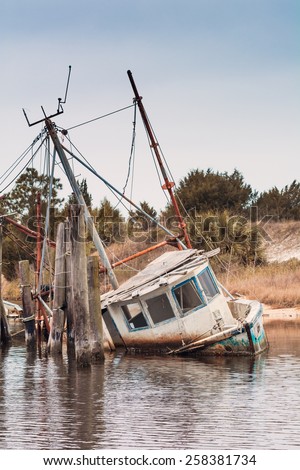 Damaged abandoned shrimping boat at the Gulf of Mexico