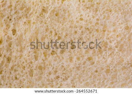 Macro close up of white bread.  Nutritious style of white bread that is whole grained giving it a yellow tan color.