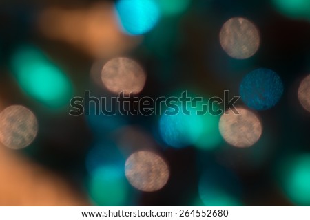 Beautiful natural teal, turquoise, blue and rust blur bokeh abstract against black