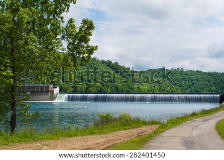 Taneycomo dam runs water into Bull Shoals lake during a Missouri late spring.