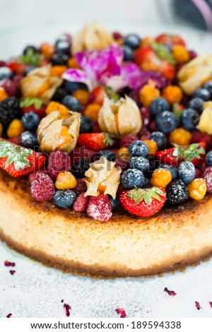 Closeup of delicious sponge cake topped with fresh berries