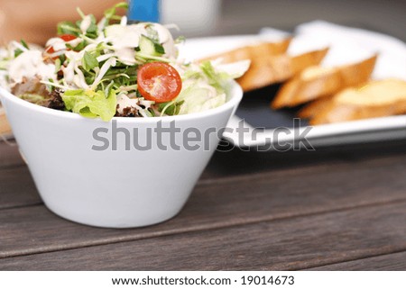 Delicious garden salad and bread on a table