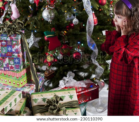 a christmas surprise / a really lot of presents / surprised little girl