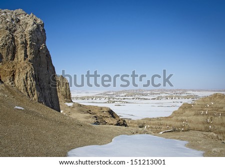 Badlands National Park after an early spring snowfall. The park, in southwestern South Dakota, consists of  sharply eroded buttes, pinnacles and spires surrounded by a mixed-grass prairie ecosystem.