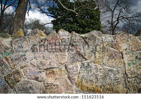 Closeup view of the graffiti covered wall in from of Graceland, Elvis Presley\'s home in Tennessee.