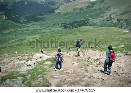 Mountain Summit Hikers Summer. Colorado Summer Mountain Backcountry Scene. Great for themes of nature, summer, mountains, outdoor recreation, travel destinations, background scenic.