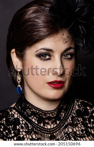 Closeup portrait of a serious lady with smoky eye makeup