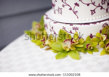 White and Purple Wedding Cake with Flowers