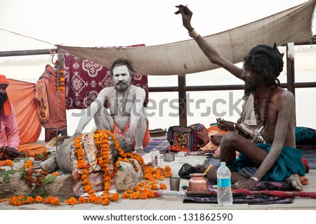 VARANASI, INDIA - MARCH 10: Shaiva sadhus perform yagna prayer rituals of Lord Shiva on the auspicious Maha Shivaratri festival on March 10, 2013 at Varanasi, Uttar Pradesh, India.