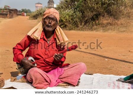 BISHNUPUR, INDIA - DECEMBER 20: A Baul - Indian folk singer performs in front of Jorbangla temple on December 20, 2014 in Bishnupur, West Bengal, India.