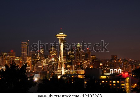 Seattle downtown skyline with office buildings and entertainment center also known as Space-needle which is a popular tourist attraction.