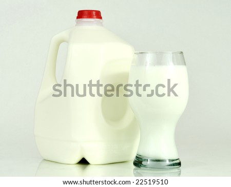 one gallon milk container and a glass of milk