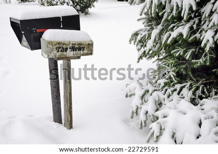 old broken mailboxes, newspaper boxes and trees covered in the snow