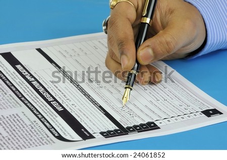 a gentleman filling up a voter registration form to be eligible for voting