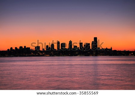 silhouette of the emerald city - Seattle skyline over pre-dawn sky