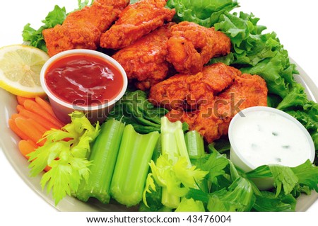 Spicy buffalo chicken wings served with hot and sour dip and crispy veggies
