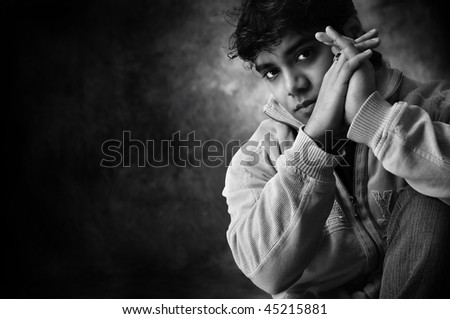Dramatic portrait of a young man in black and white