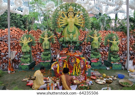 CALCUTTA - OCTOBER 16: Unidentified hindu priests worship the goddess in Durga puja festival on October 16, 2010 at Barisha Club, Calcutta, India. Barisha Club won the Best Puja award of 2010.